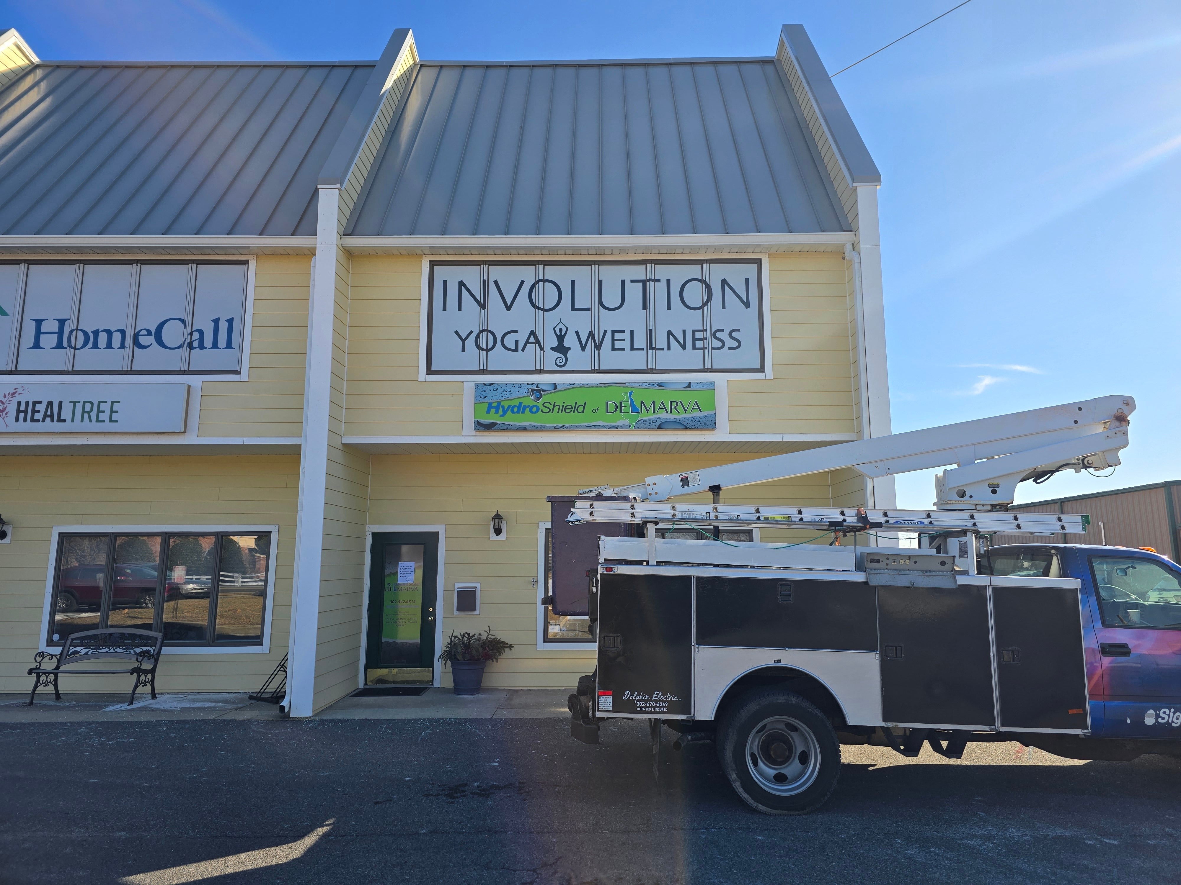 Involution Yoga and Wellness Window Graphics and Updated Pylon