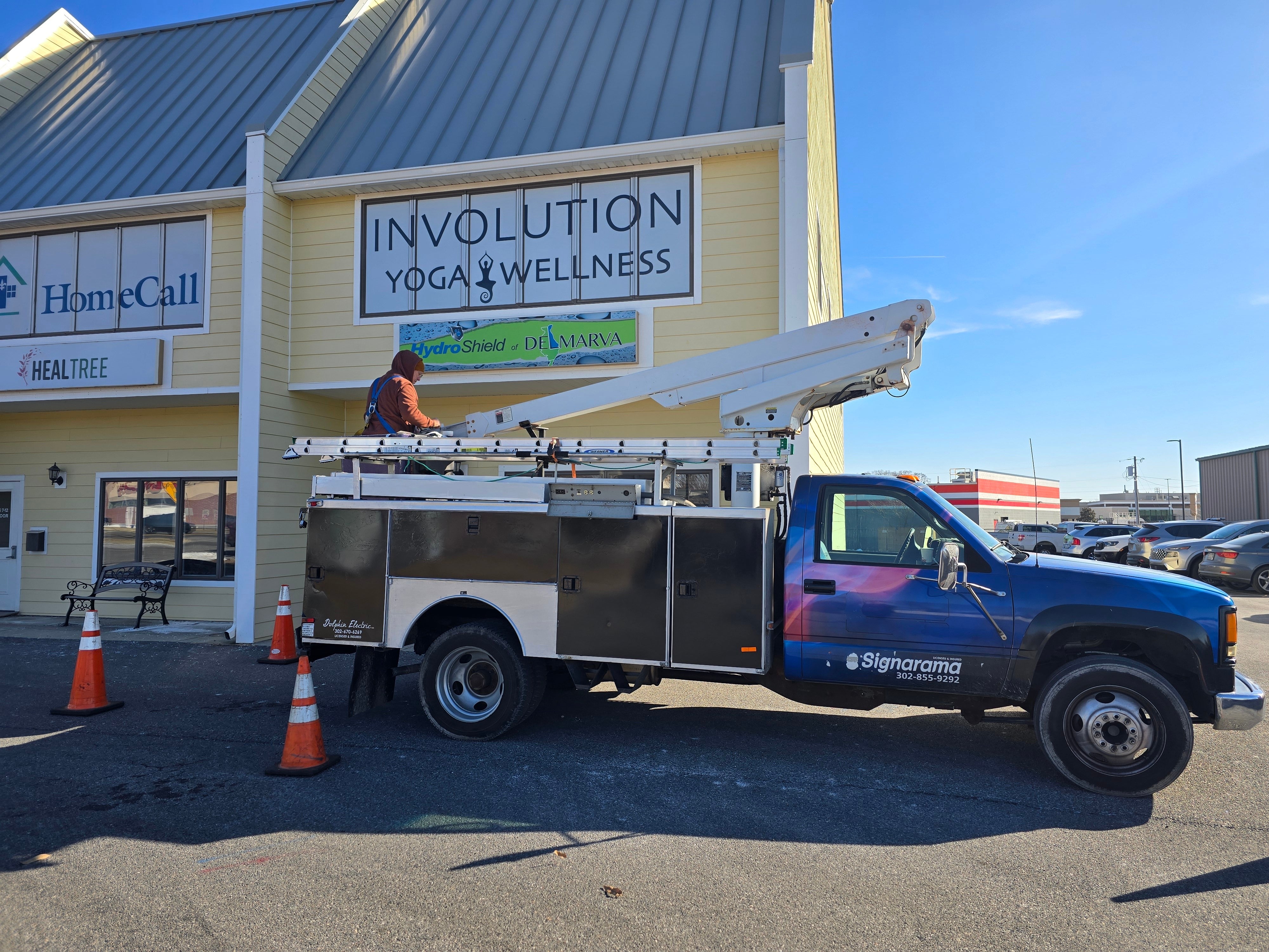 Involution Yoga and Wellness Window Graphics and Updated Pylon