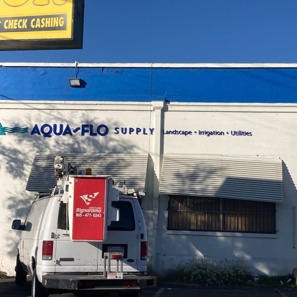 Dimensional lettering building sign for Aqua Flo Supply designed and installed by Signarama