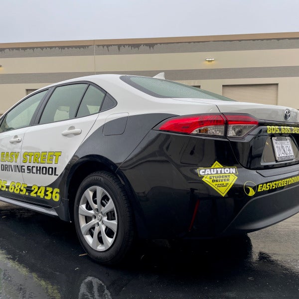 Easy Street Driving School vehicle wrap designed by Signarama showcasing branding and safety features