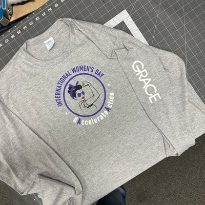 https://cdn.gorilladash.com/images/media/16394806/fully-promoted-usa-international-womens-day-t-shirt-printed-for-w-r-grace-square-67c2357f47439.jpg?auto=webp&crop=1%3A1%2Csmart&width=400