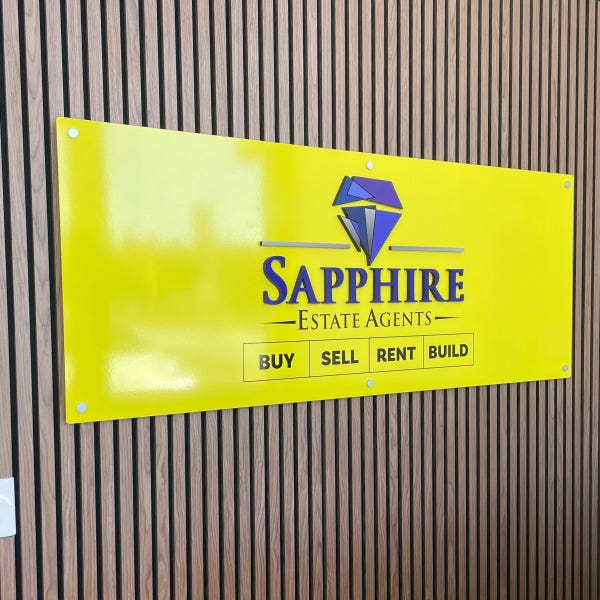 Acrylic signage with 3D letters and vinyl applied to acrylic base and attached to wall via stand-off mounts.