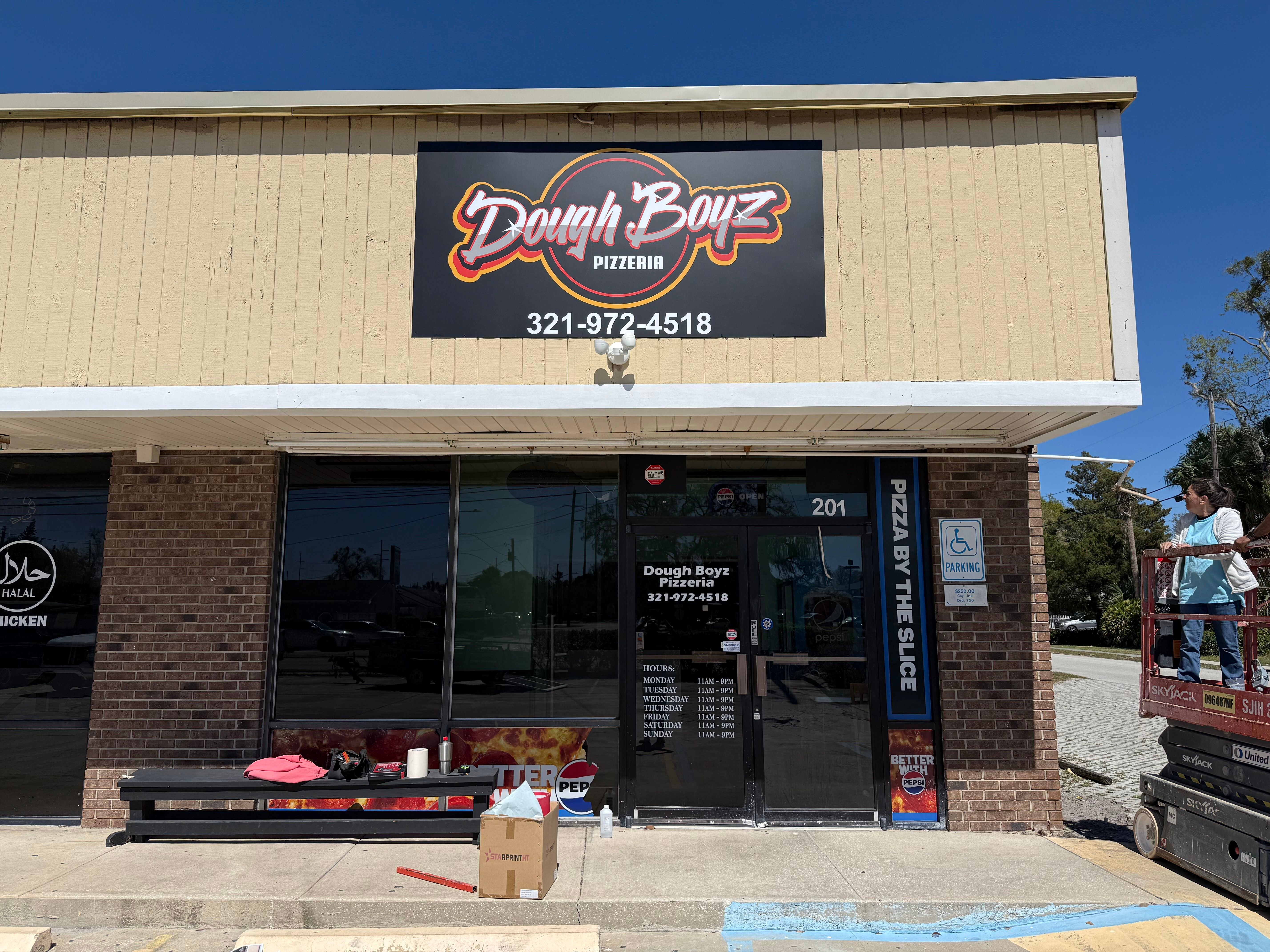 Newly Installed Store Front Sign with Window Graphics