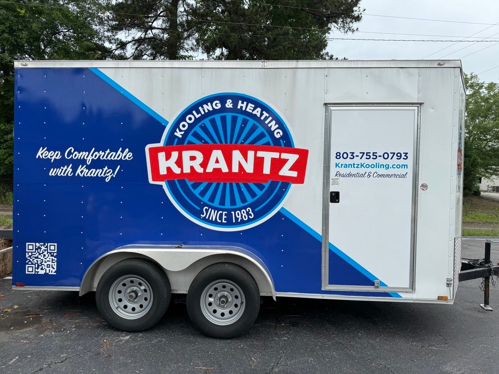 Custom fleet vehicle wrap with full-color vinyl graphics for professional business branding and mobile advertising.
