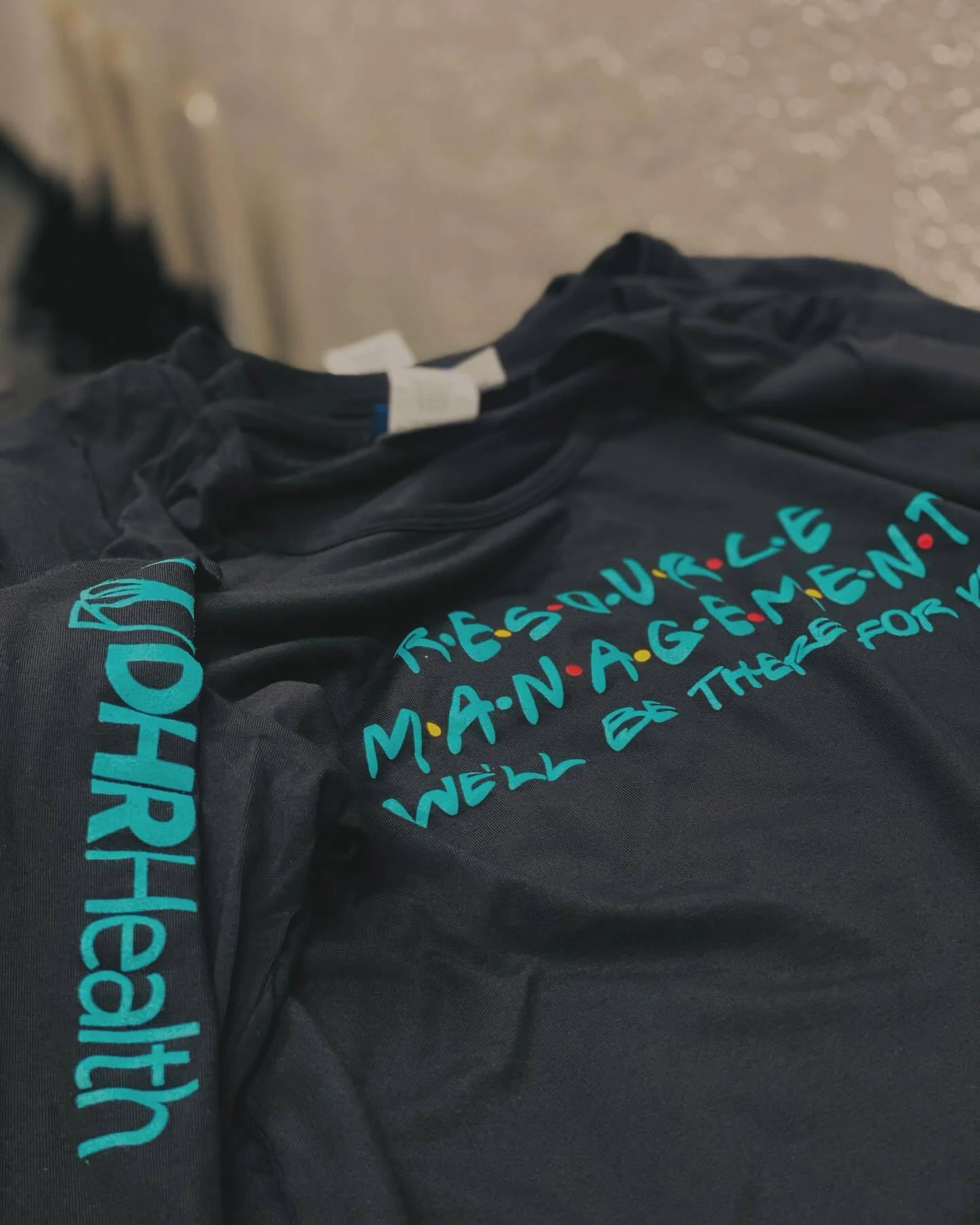 DHR Resource Managment Rocking Around the Christmas Tree with Thier New Christmas Branded T-shirts