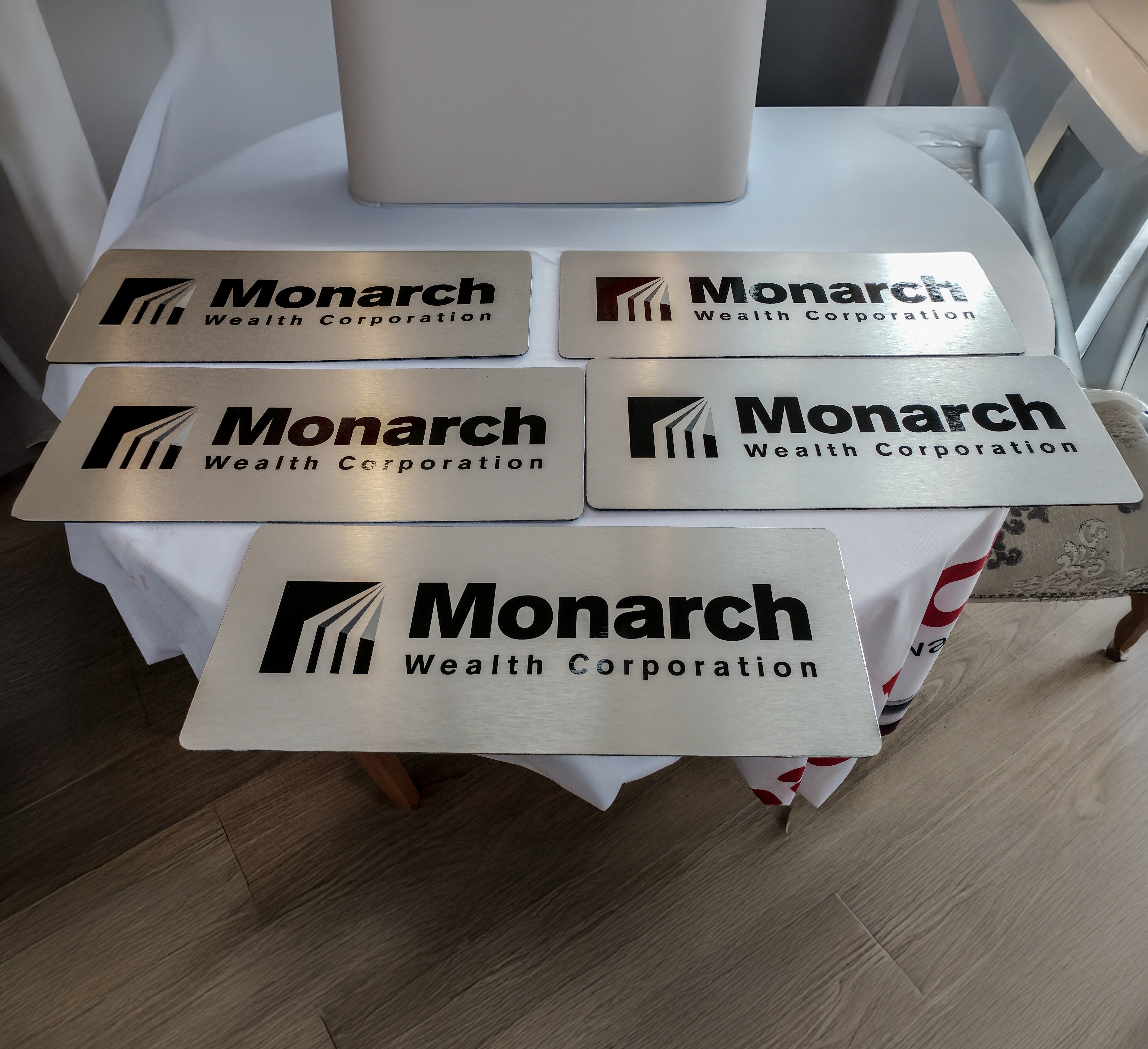 Monarch Wealth Corporation’s brushed metal plaques