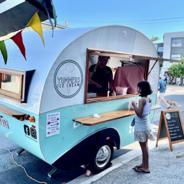 Signage that complements this cute food trailer!