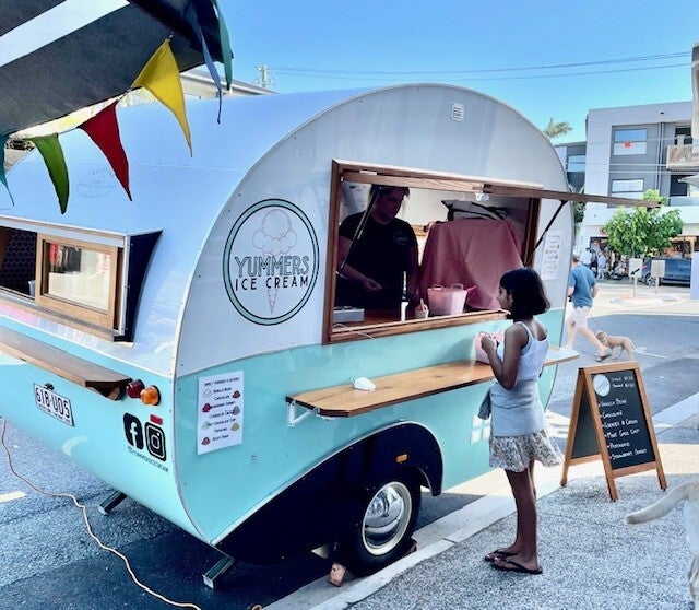 Signage that complements this cute food trailer!