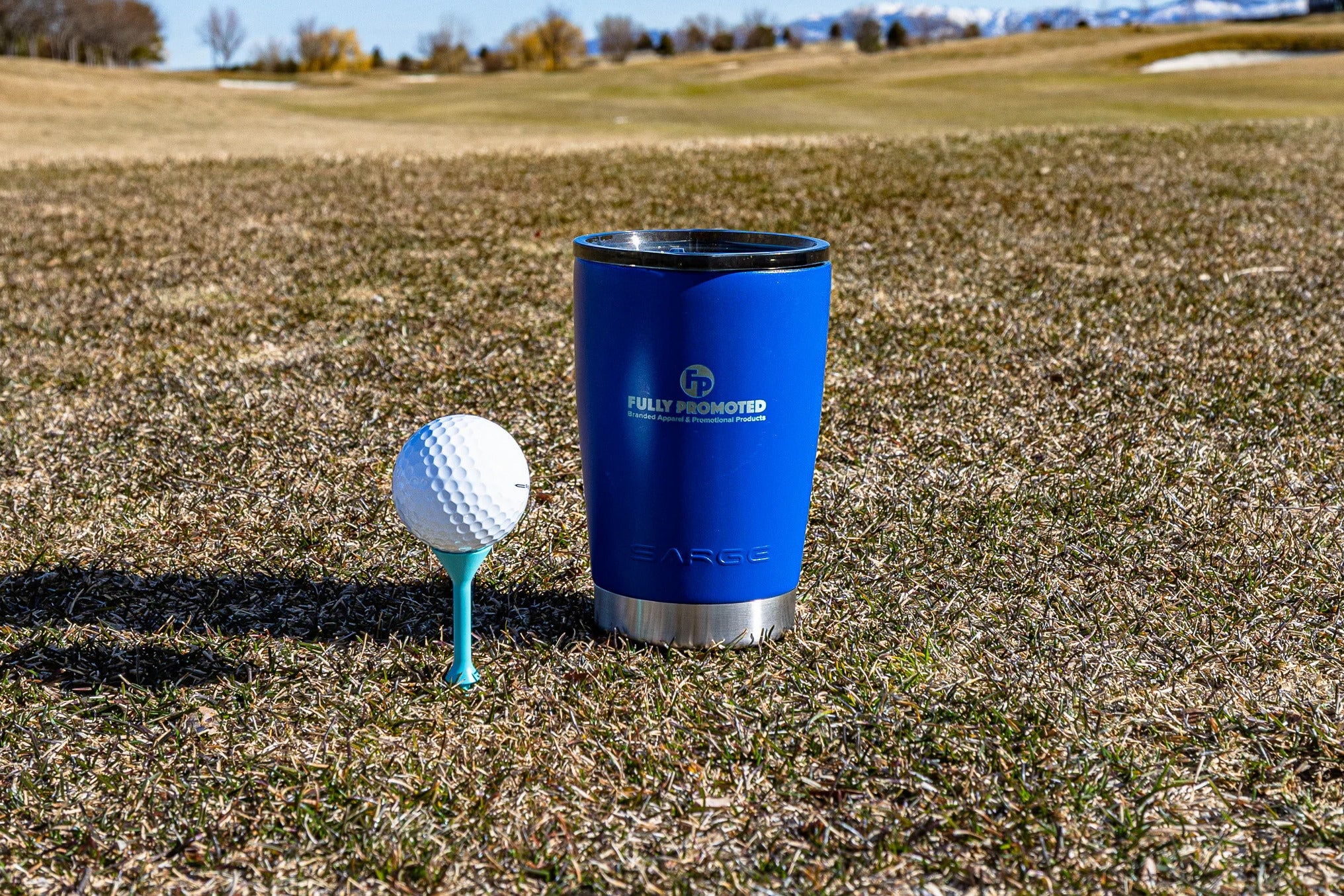 Branded Golf Ball next to a Fully Promoted Branded reusable botte