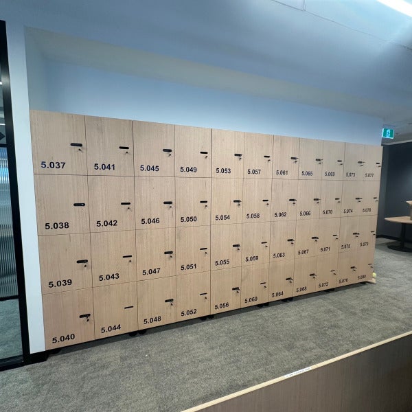 Numbered vinyl wayfinding graphics applied to face of locker doors by Signarama Brendale.