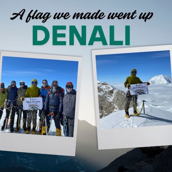 Non-profit takes flag up the mountain for its namesake