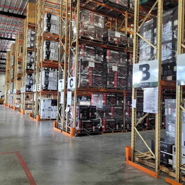 ACM signs installed to metal shelving structure indicating aisle numbers for Encel warehouse by Signarama Brendale.