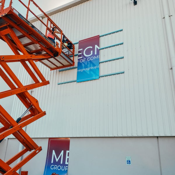 Large-Scale Warehouse Signage for Megna Group