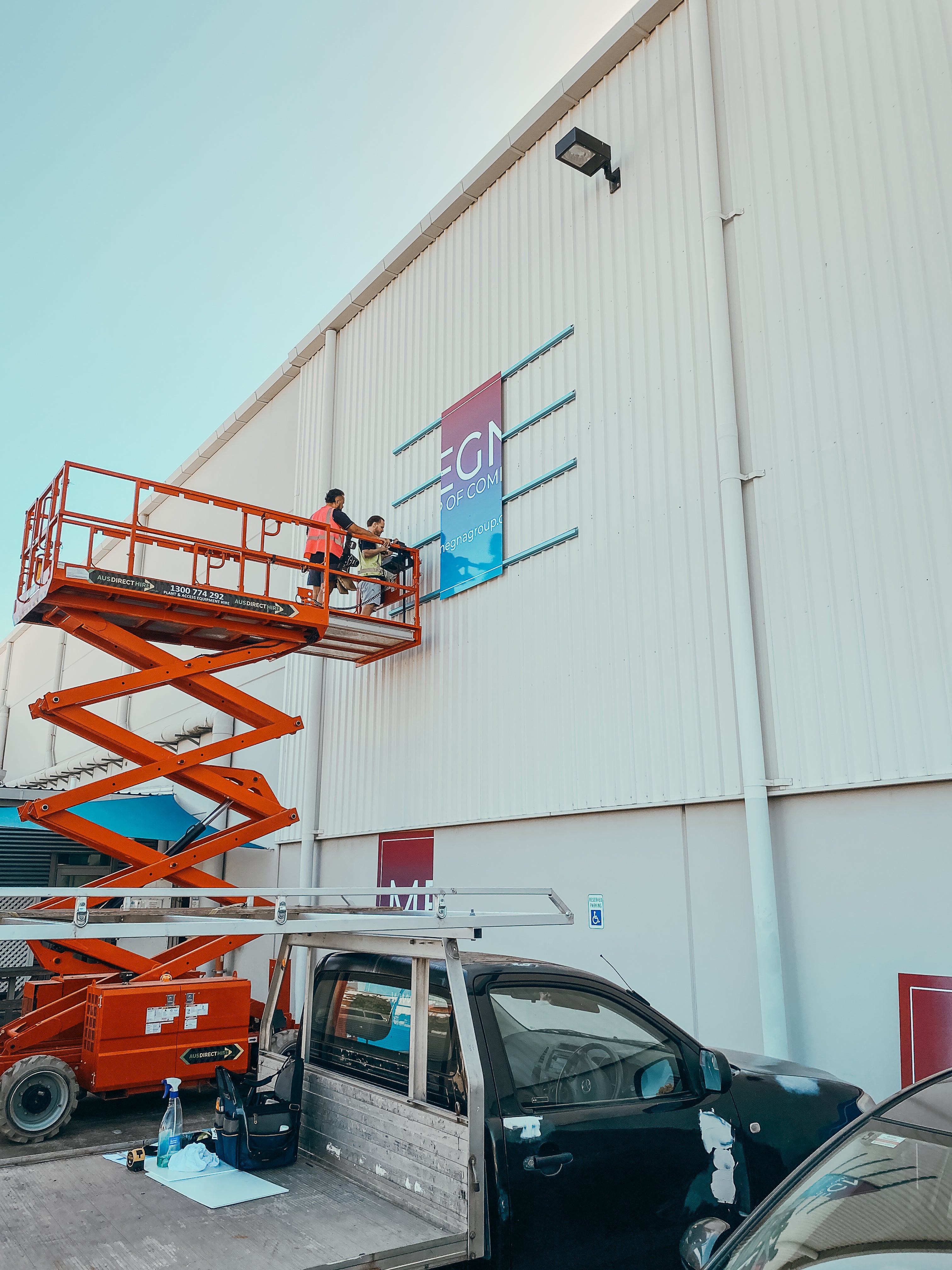 Large-Scale Warehouse Signage for Megna Group