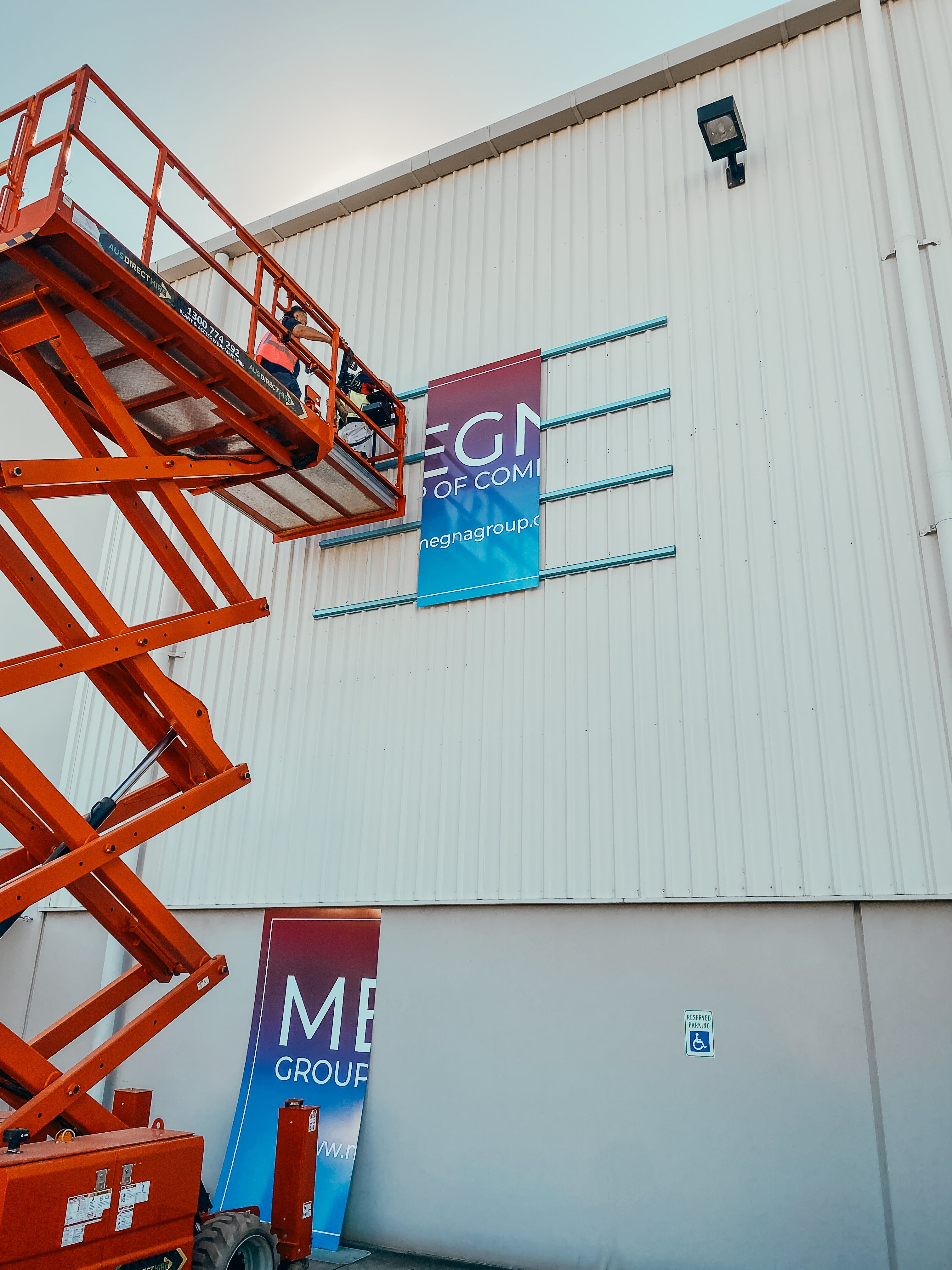 Large-Scale Warehouse Signage for Megna Group