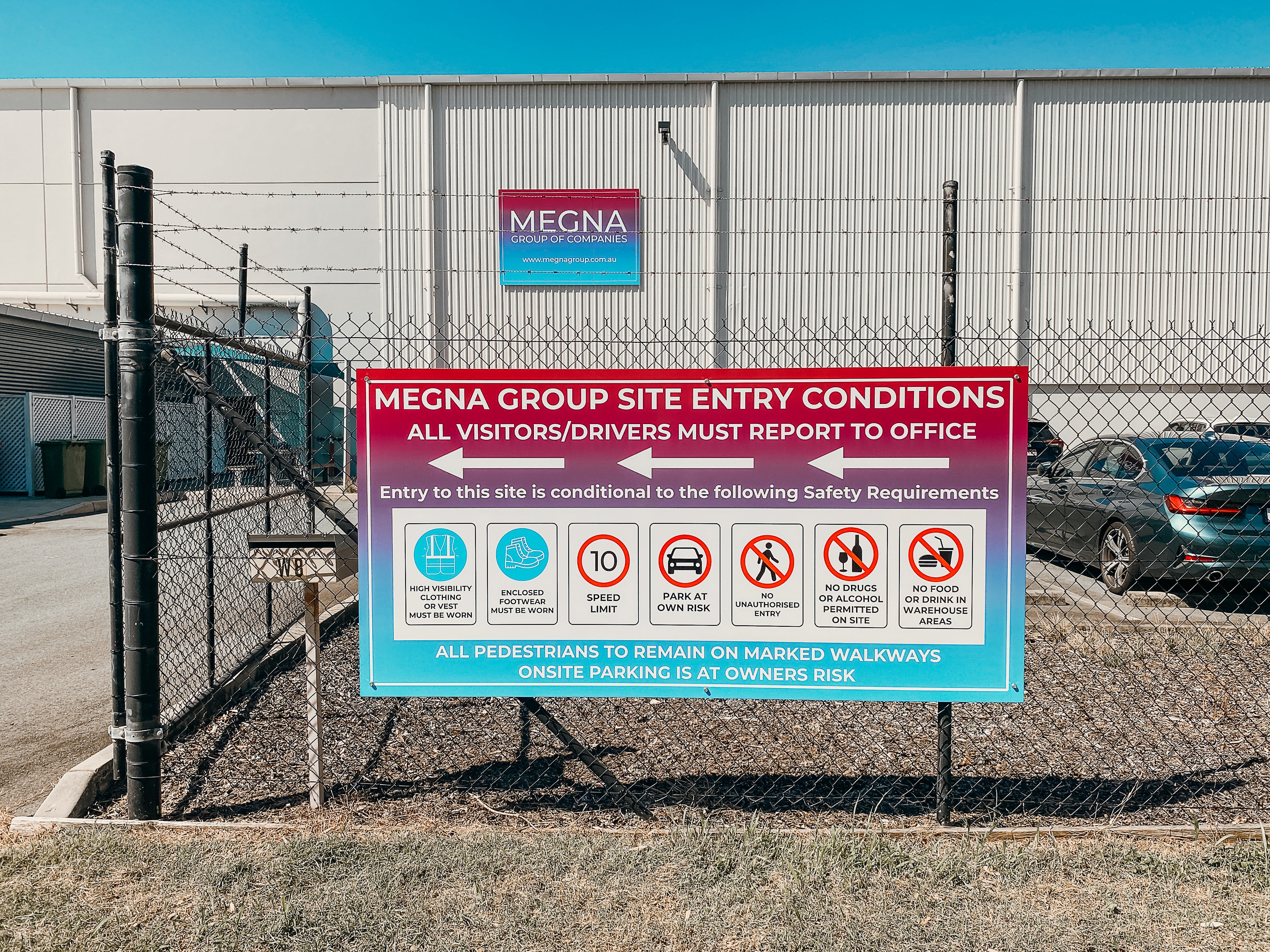 Large-Scale Warehouse Signage for Megna Group