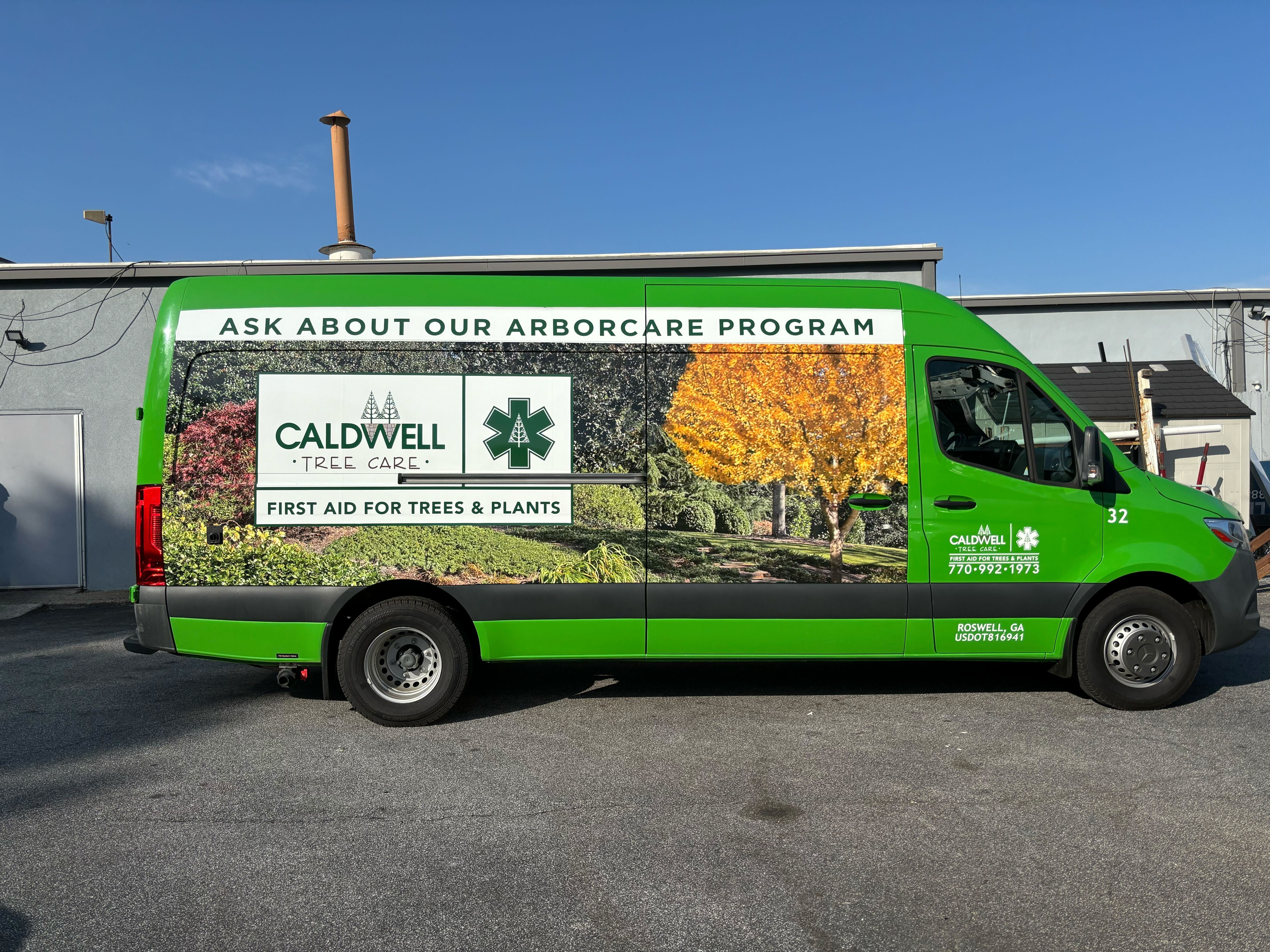 Partial vehicle wrap for Caldwell Tree Care van with vibrant green branding, arborcare program promotion, and scenic tree imagery, installed by Signarama Roswell