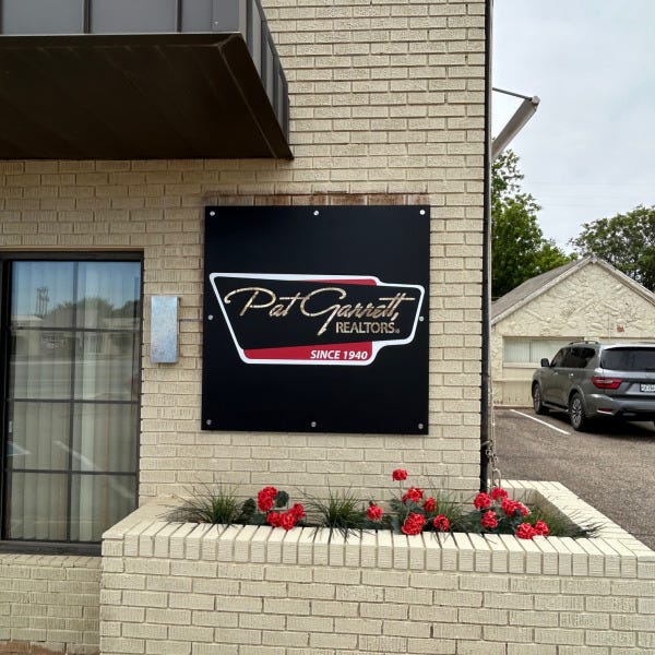 Pat Garrett Realtors Sign