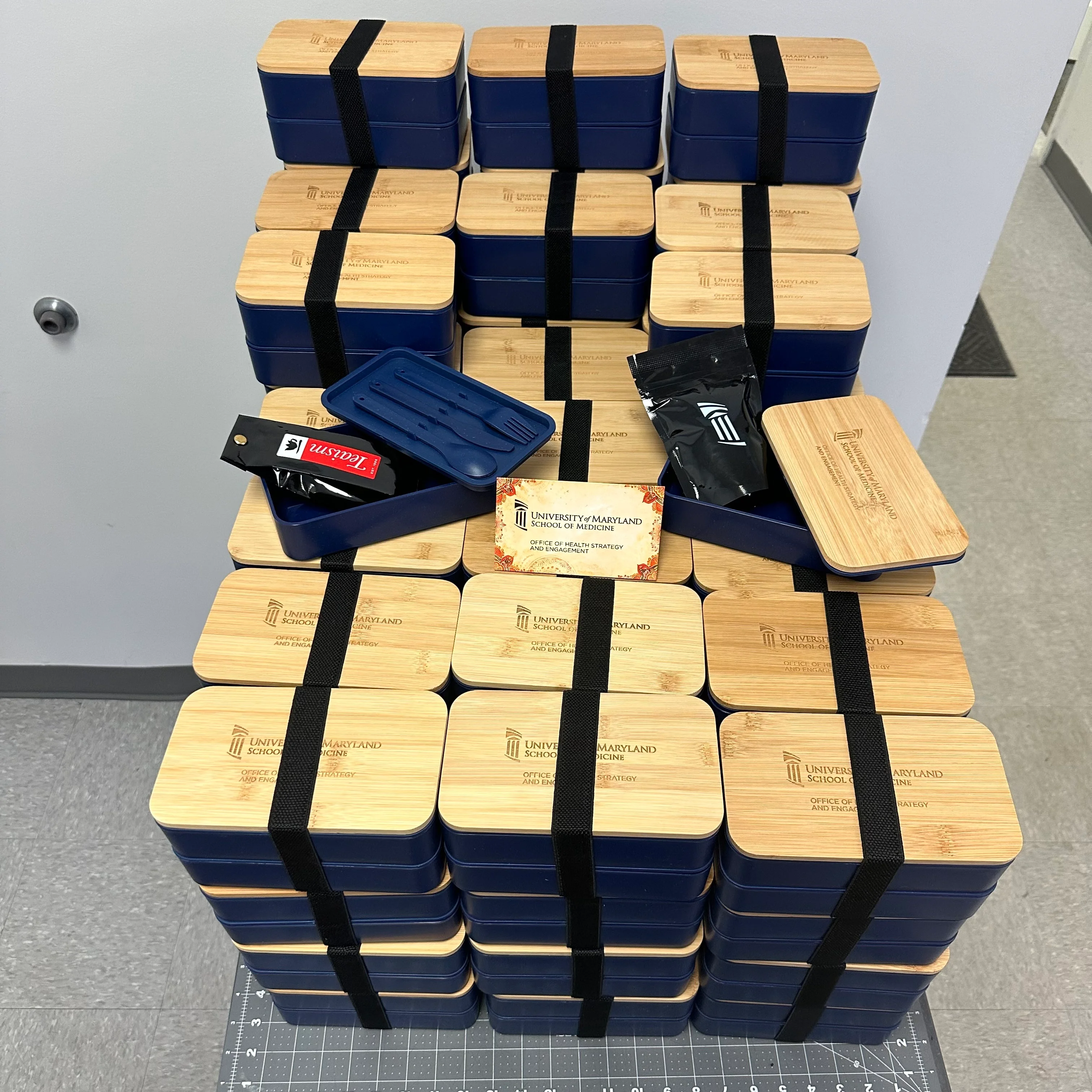 Custom bento boxes, branded and filled, for participants in a local AAPI Heritage Month event