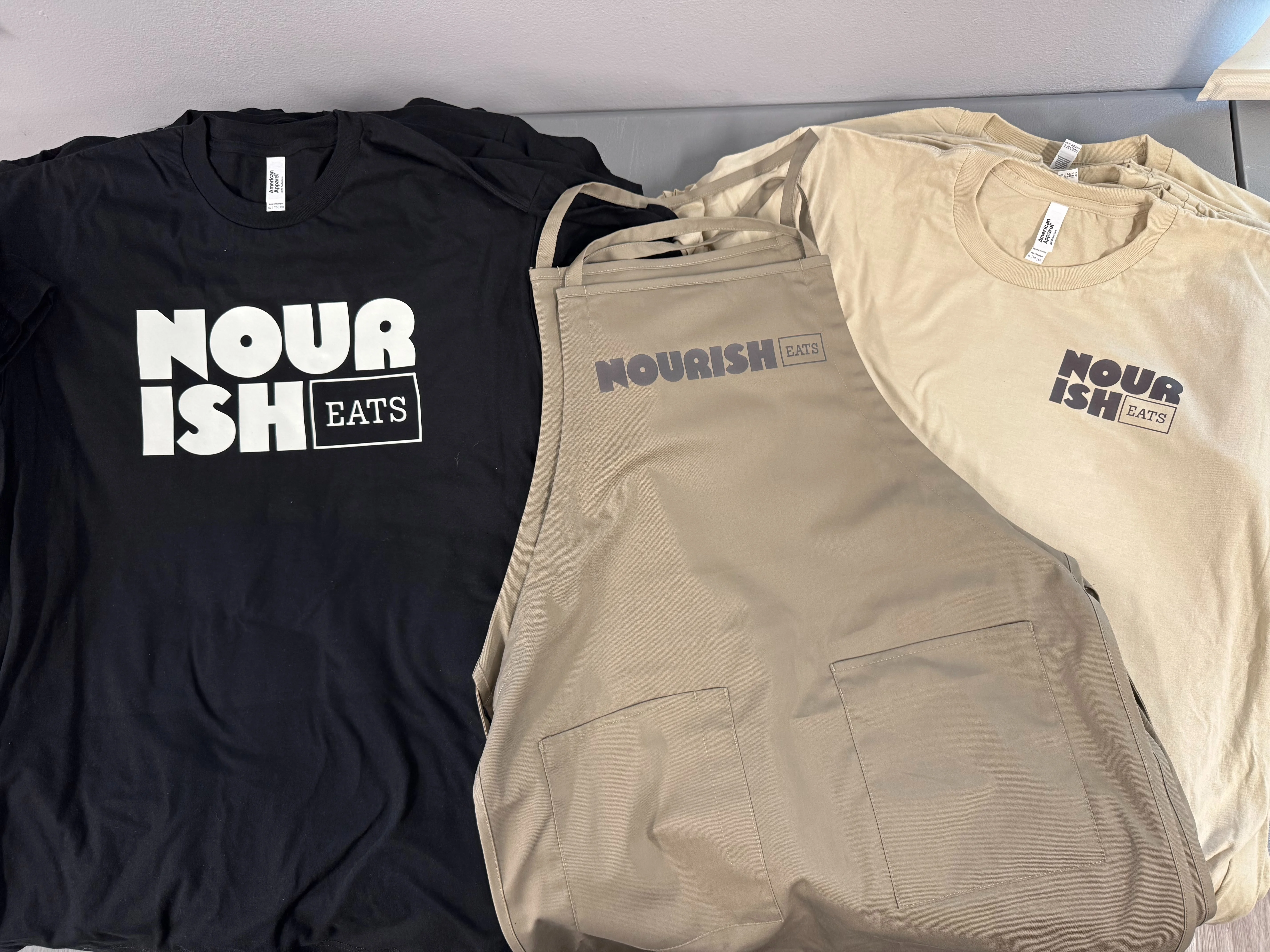 Check out the T-shirts and Uniforms we made for Nourish Eats Grand Opening!