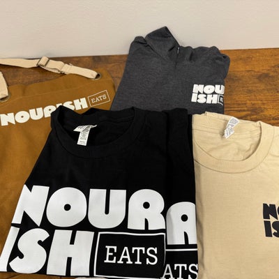 https://cdn.gorilladash.com/images/media/17489947/fully-promoted-usa-nourish-eats-grand-opening-shirts-square-6877da38efc1c.jpg?auto=webp&crop=1%3A1%2Csmart&width=400
