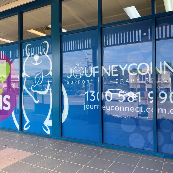 One-way vision window signage graphics