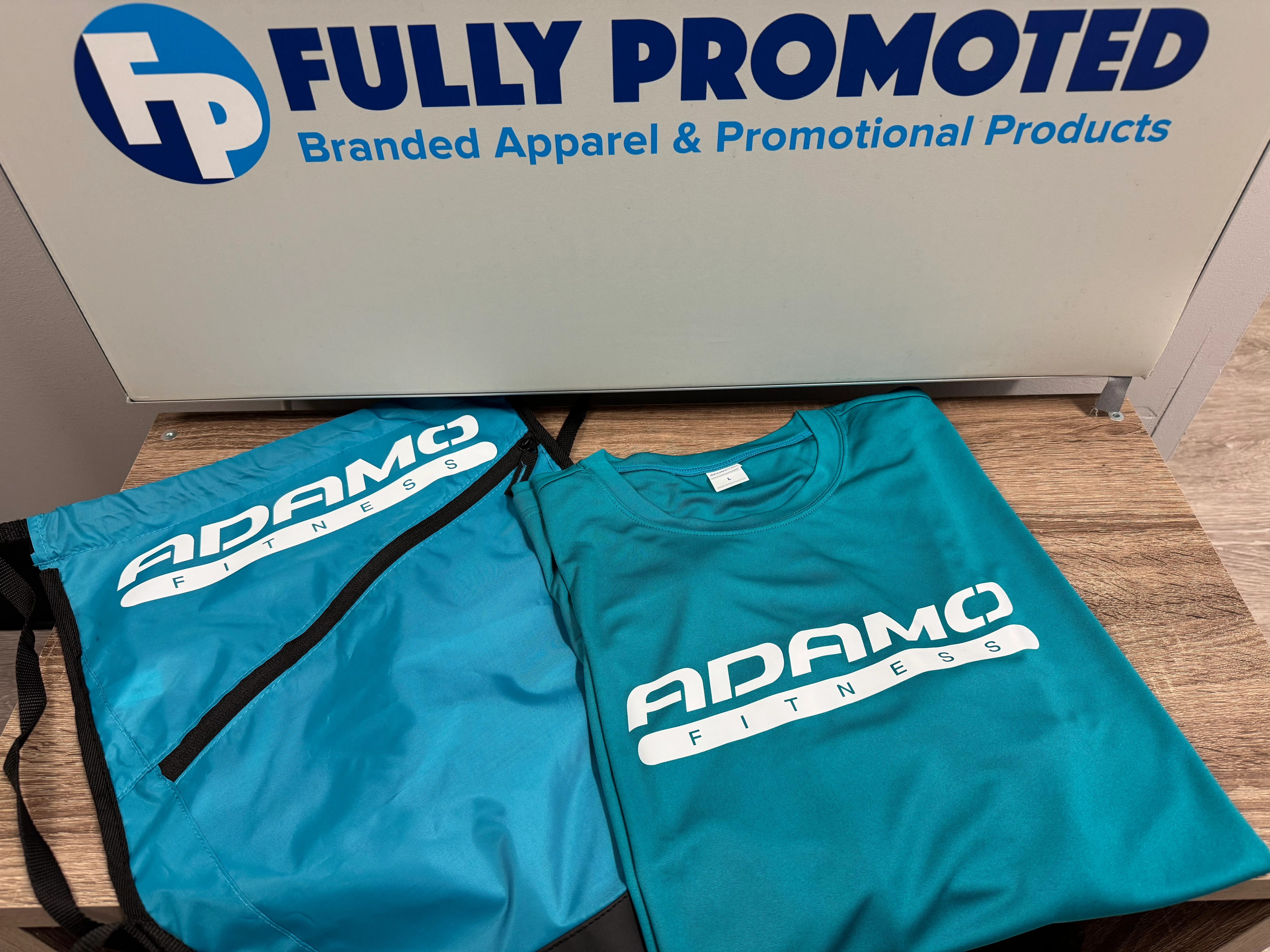 Custom fitness bag and t-shirt package for Adamo Fitness!