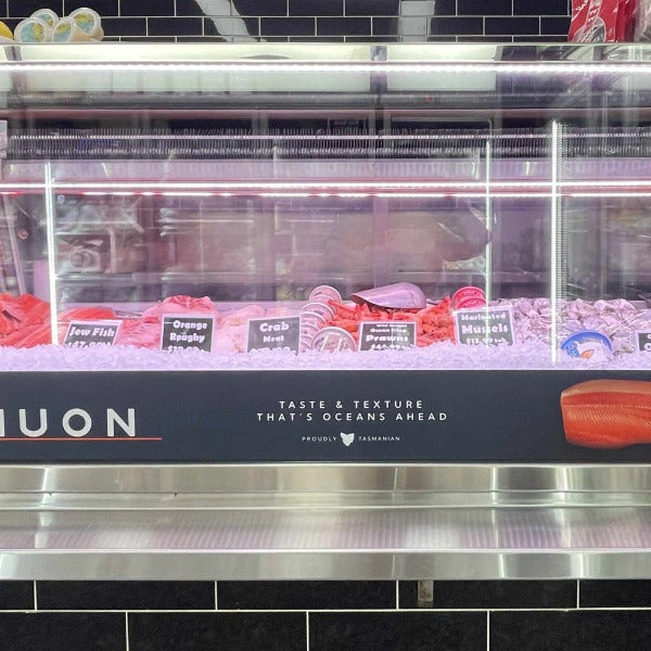 Window vinyl graphics applied to display window of Huon commercial store by  Signarama Brendale.