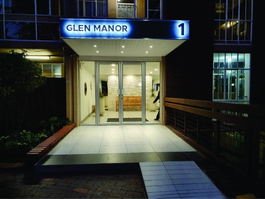 ENTRANCE BACKLIT LETTERS ON PINS ON FRAMED BACKING BOARD