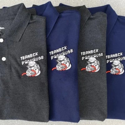 https://cdn.gorilladash.com/images/media/19176283/fully-promoted-usa-custom-embroidered-polos-for-teaneck-doghouse-square-68af3c1b2af58.jpg?auto=webp&crop=1%3A1%2Csmart&width=400