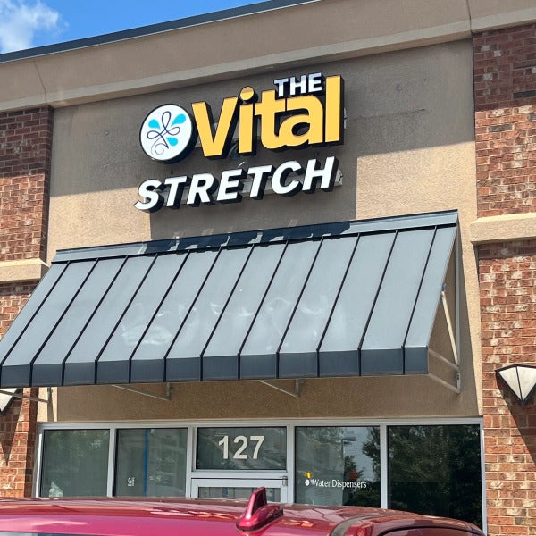 Custom illuminated channel letter sign installed by Signarama Roswell for The Vital Stretch in Roswell GA