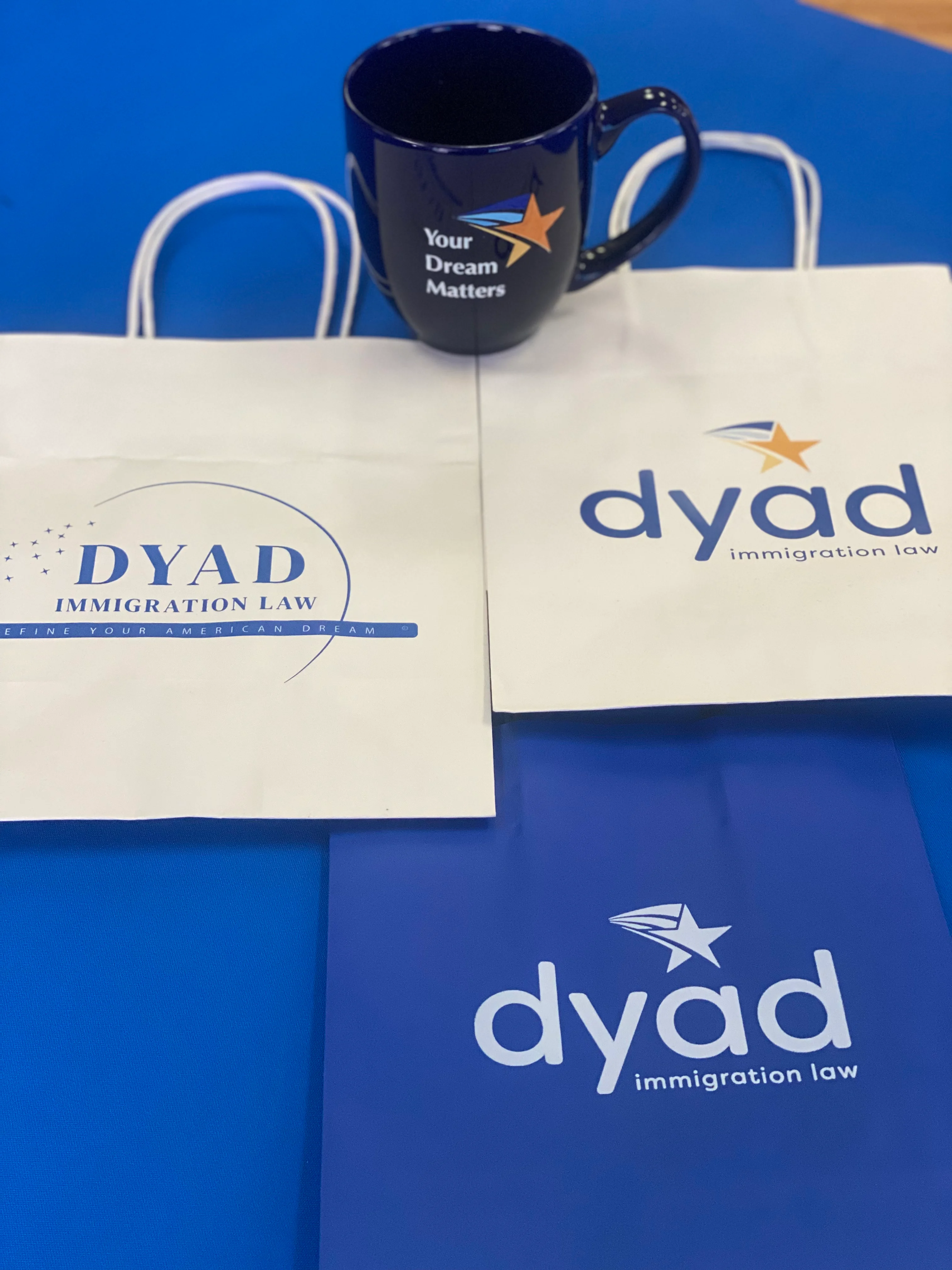 Promo items for DYAD Immigration Law