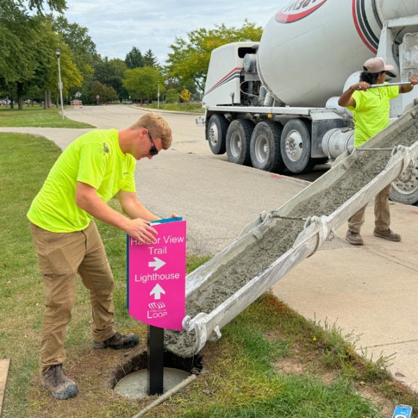 Signage for the Loop Bike Trail being installed