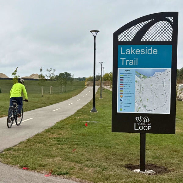 Lakeside Trail Loop sign with biker