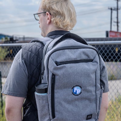 https://cdn.gorilladash.com/images/media/19509403/fully-promoted-usa-mm-0825-your-logo-here-backpack-square-68e6825e25627.jpg?auto=webp&crop=1%3A1%2Csmart&width=400