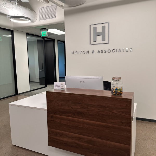 Signarama – Costa Mesa designed and installed a brushed aluminum dimensional lobby sign for Hylton & Associates