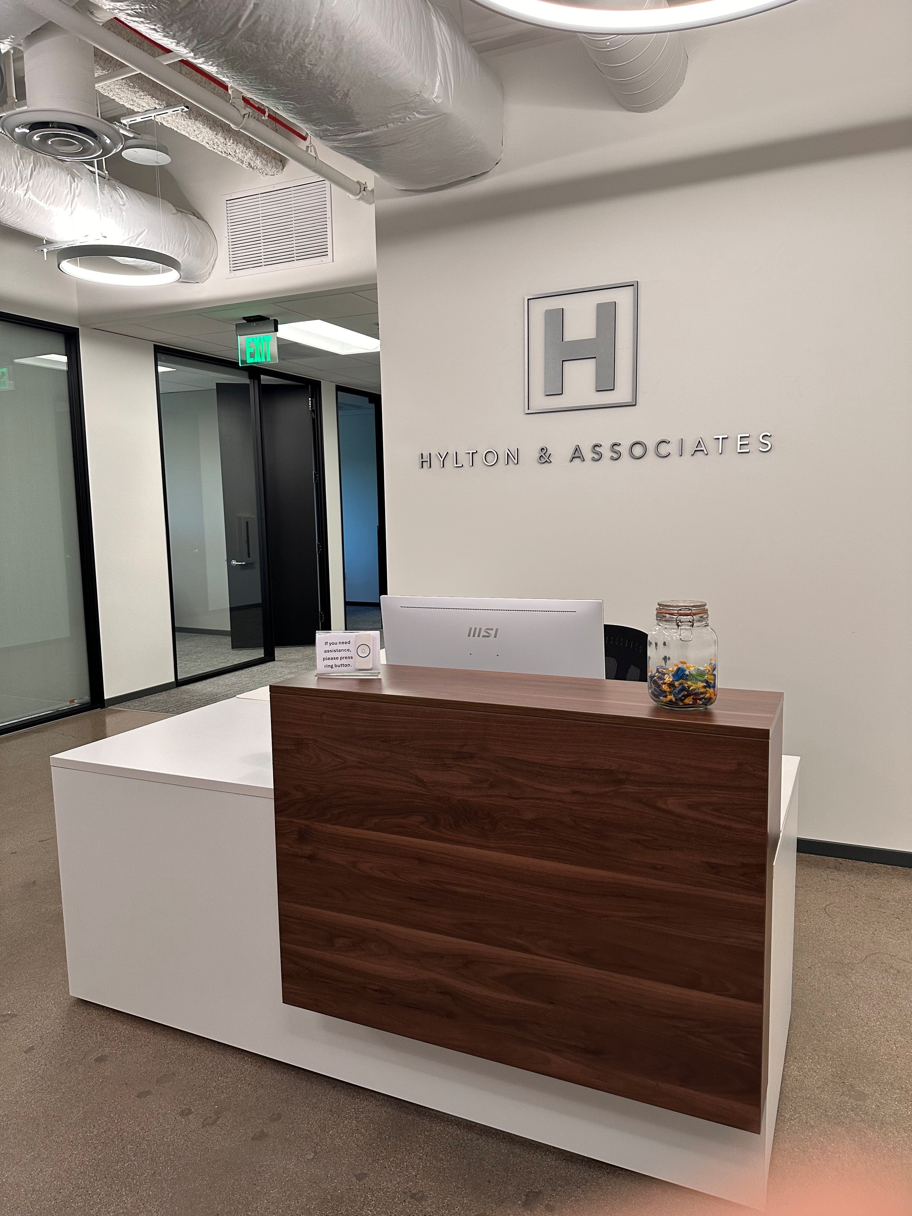 Signarama – Costa Mesa designed and installed a brushed aluminum dimensional lobby sign for Hylton & Associates