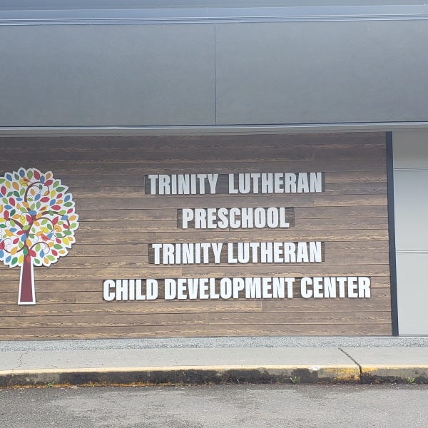 Trinity Lutheran Church and school Mural sign