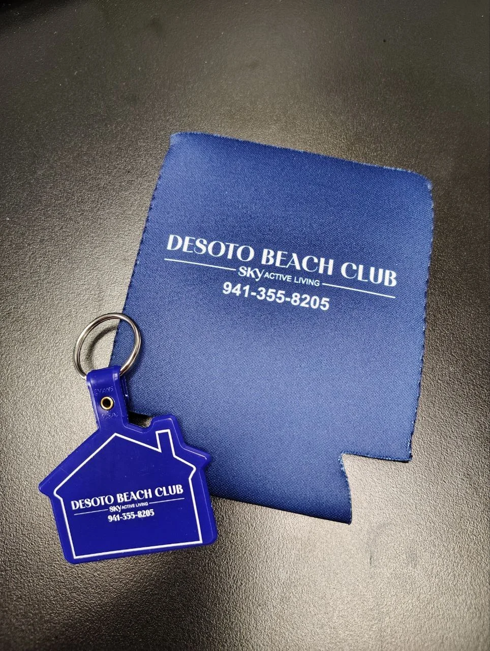 Custom can-coolers and key tags for DeSoto Beach Club