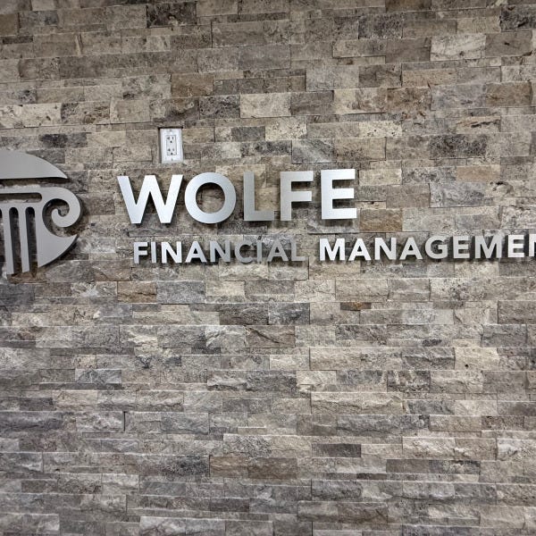 Wolfe Financial Lobby Sign Lake Mary Florida