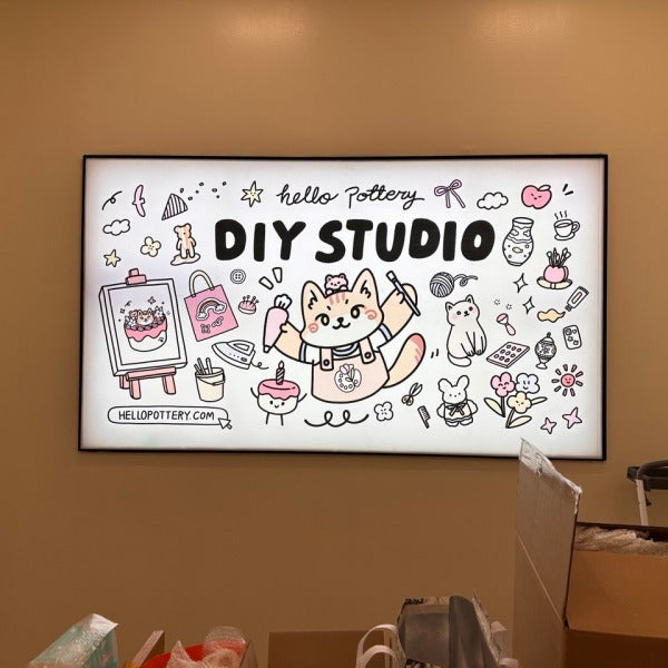Signarama – Costa Mesa produced a custom backlit fabric lightbox sign for Hello Pottery DIY Studio. Bright, colorful interior branding with energy-efficient LED illumination
