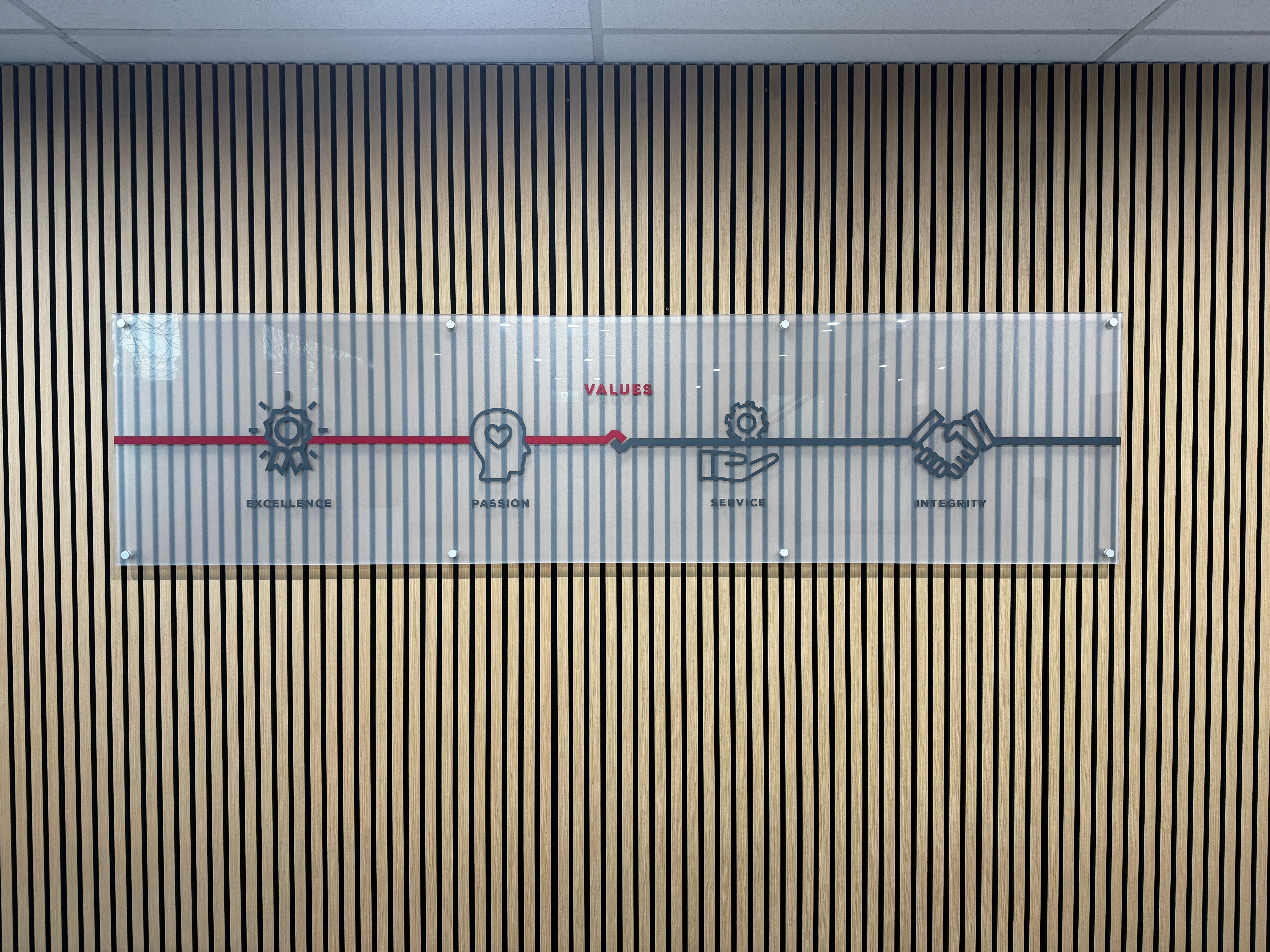 Elevating Workspace Design with Frosted Panels and Branded Decals