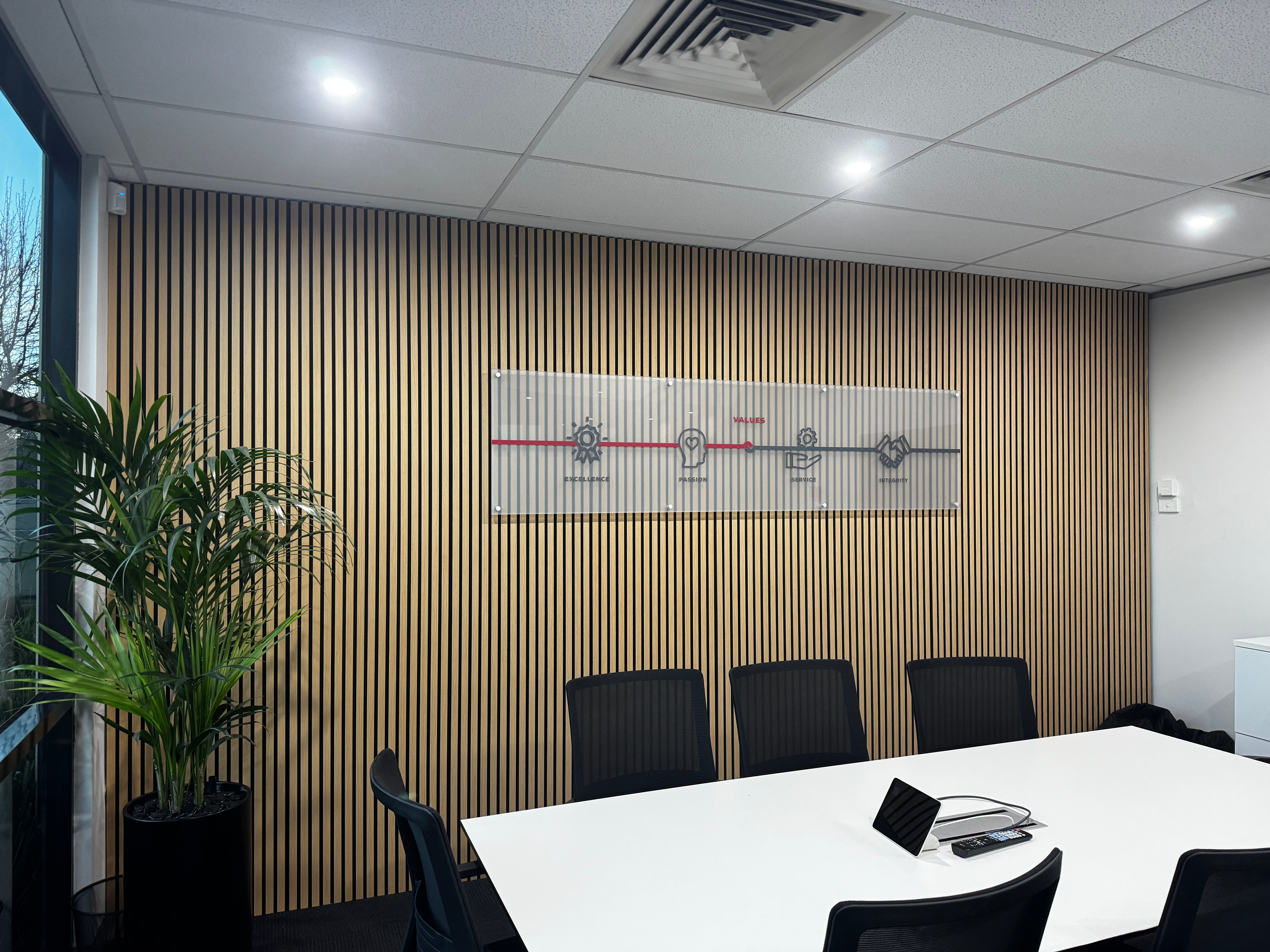 Elevating Workspace Design with Frosted Panels and Branded Decals