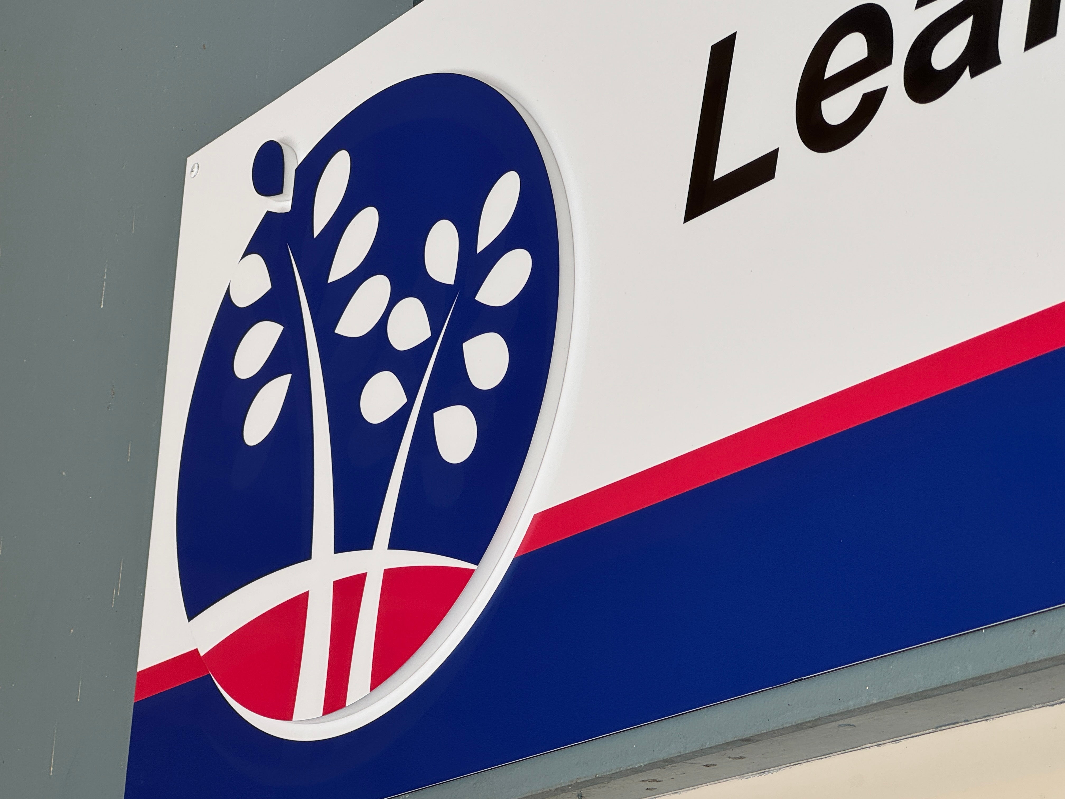 Bold Mixed-Media Fascia Sign Elevates Secondary School Entrance