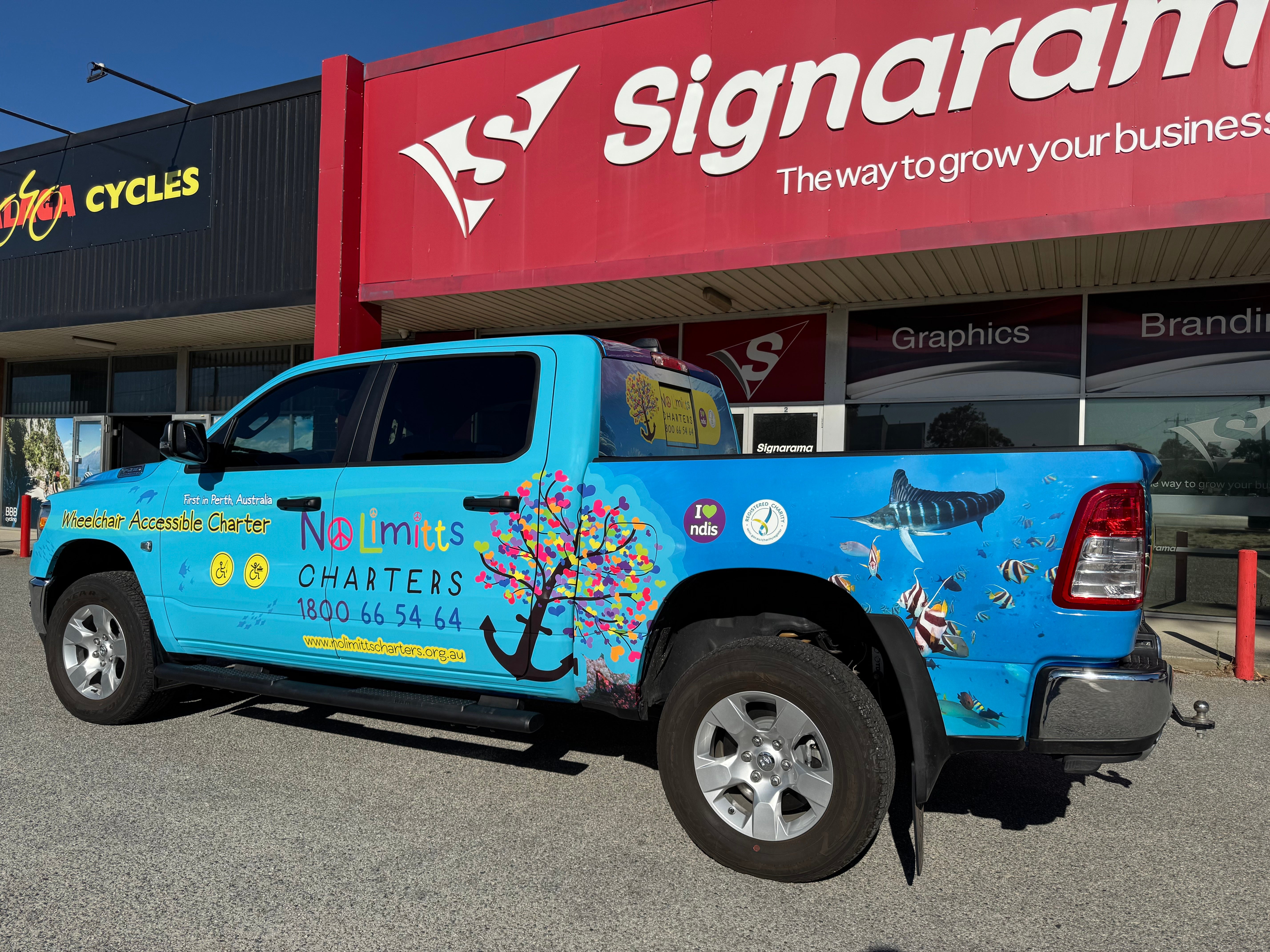 Vibrant Vehicle Wrap for No Limitts Charters by Signarama Malaga