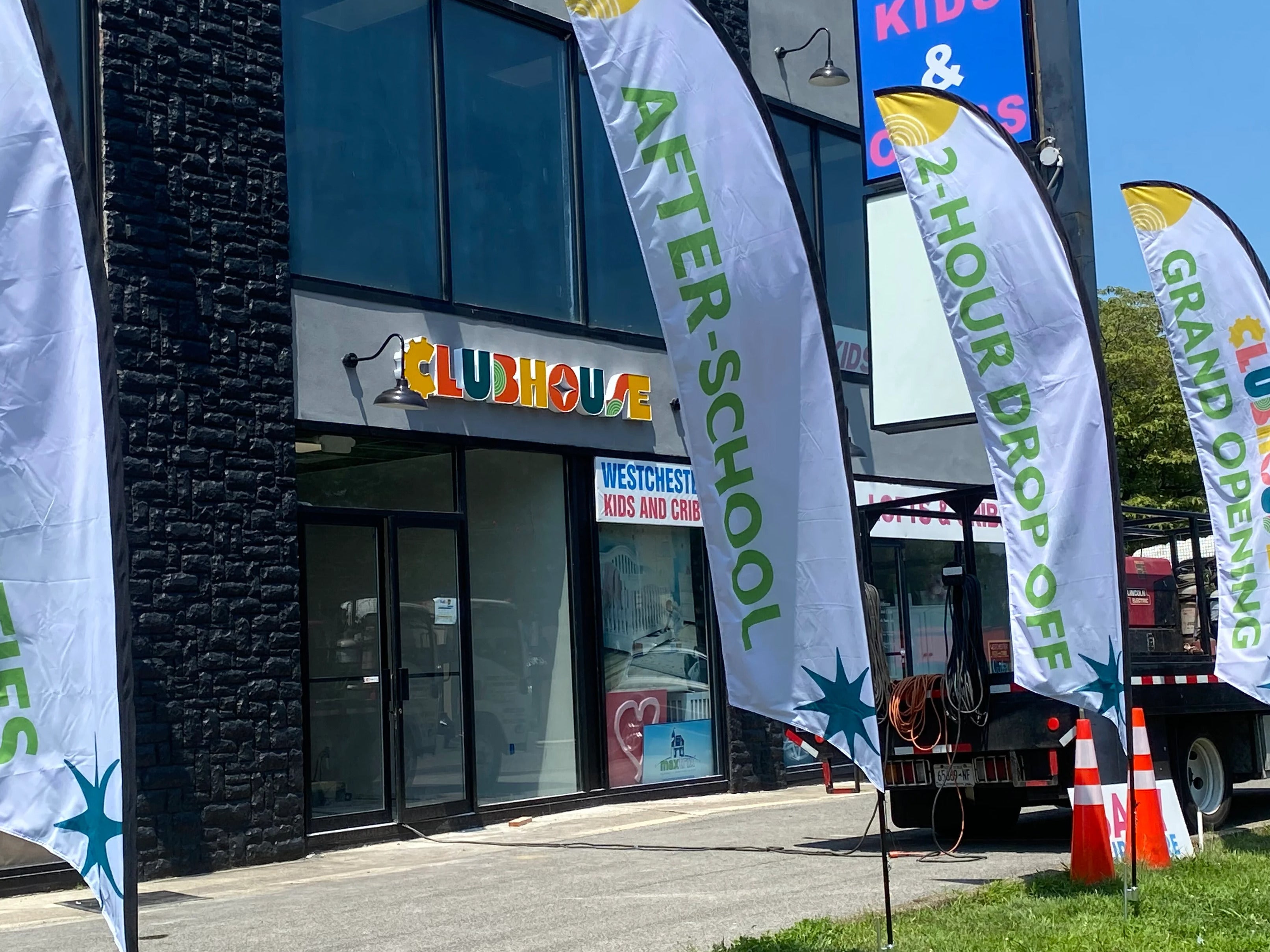 Internally Illuminated Channel Letters & Feather Flags for Clubhouse Central in Hartsdale, NY
