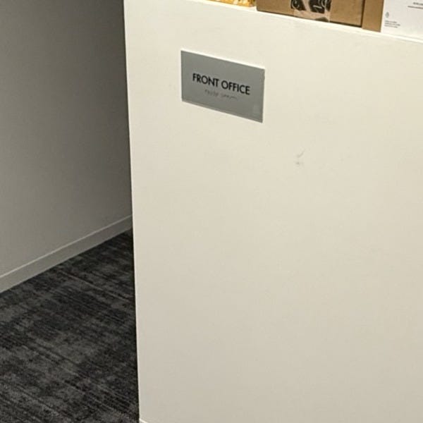 Premium Stainless Steel Room Signs for The Amatriot Group: Elevating a Modern Office Space