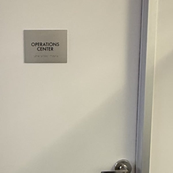 Premium Stainless Steel Room Signs for The Amatriot Group: Elevating a Modern Office Space