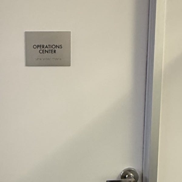 Premium Stainless Steel Room Signs for The Amatriot Group: Elevating a Modern Office Space