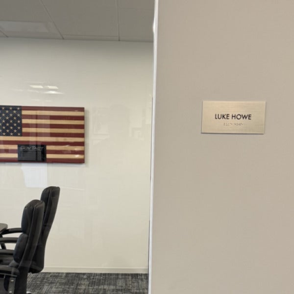 Premium Stainless Steel Room Signs for The Amatriot Group: Elevating a Modern Office Space